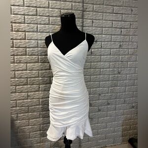 Thats So Fetch size 4 white dress with straps, slit in back, and ruffle